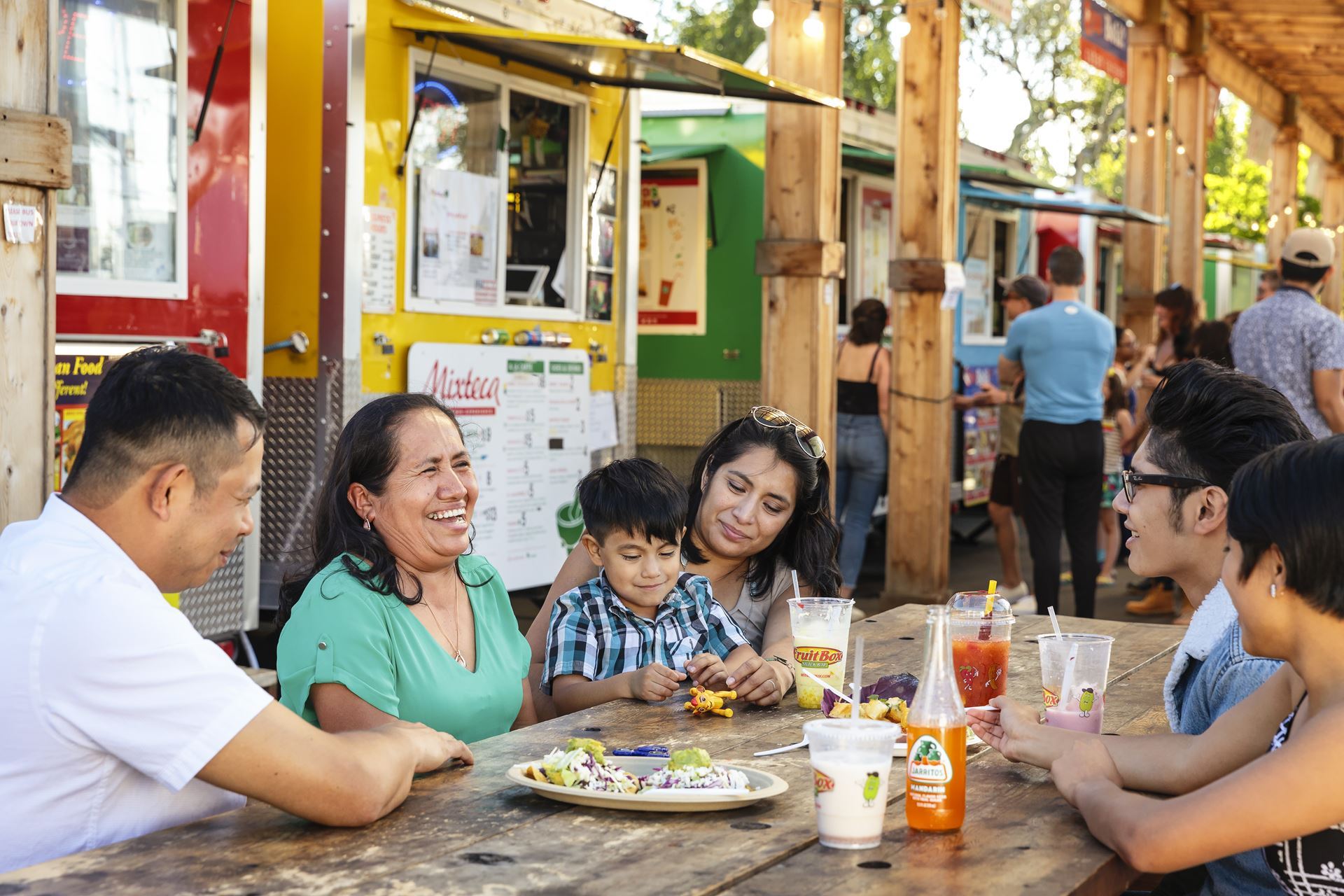 Family enjoys dining at a food cart pod